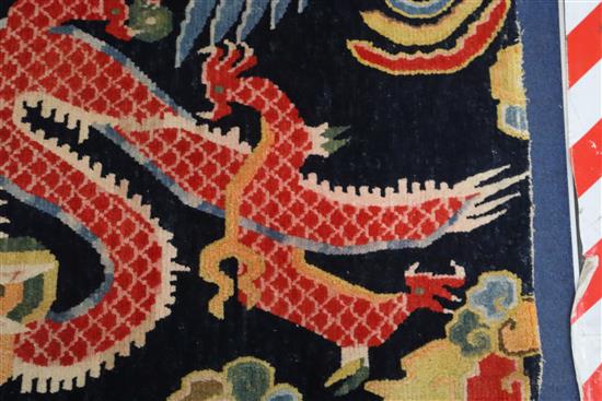 A Tibetan dragon rug, 5ft 6in. x 3ft